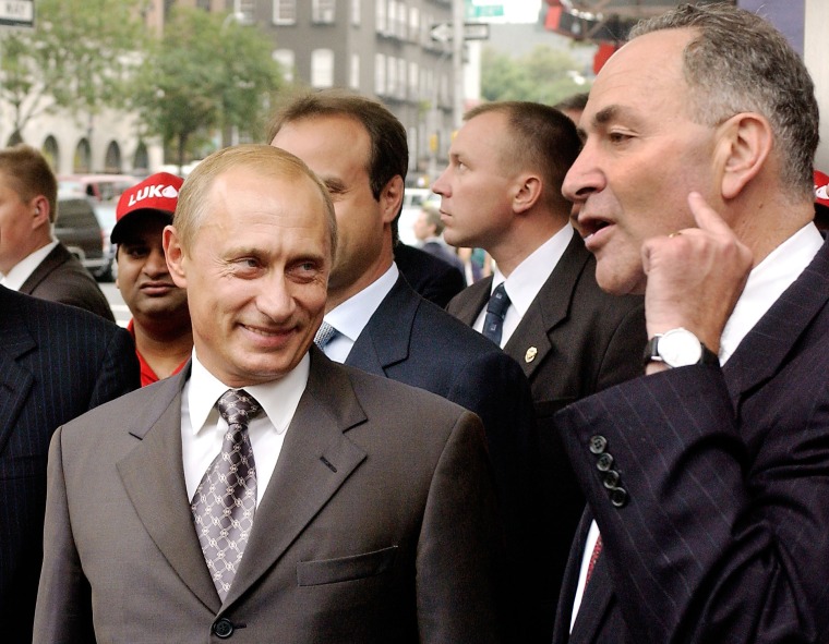 Image: Russian President Vladimir Putin listens to Senator Charles Schumer in September 2003