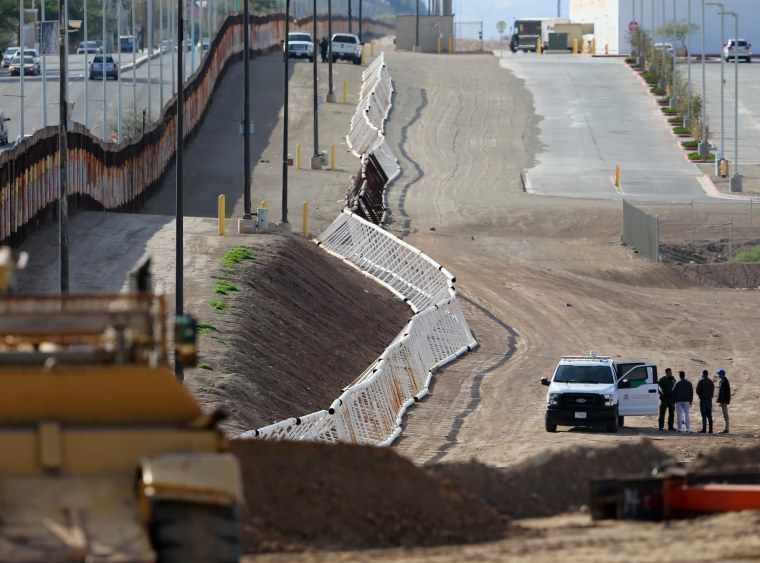 Image: Three men from India jump the fence from Mexico and give themselves up to U.S. border patrol agents in Calexico, California