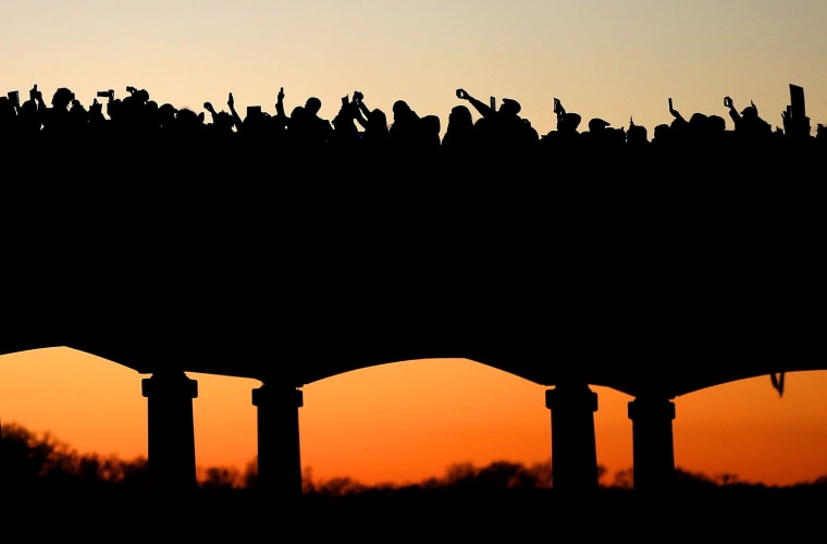 Image: Thousands march across the Edmund Pettus Bridge along with members of the cast of the movie "Selma" in honor of Rev. Martin Luther King Jr. Day on Jan. 18, 2015 in Selma, Alabama.