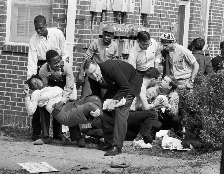 Image: Amelia Boynton is carried and another injured man tended to after they were injured when state police broke up a demonstration march in Selma, Alabama, March 7, 1965.