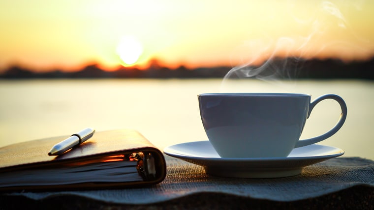 coffee cup at sunrise