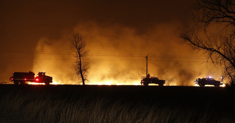 Image: Firefighters from across Kansas and Oklahoma battle a wildfire near Protection, Kan.