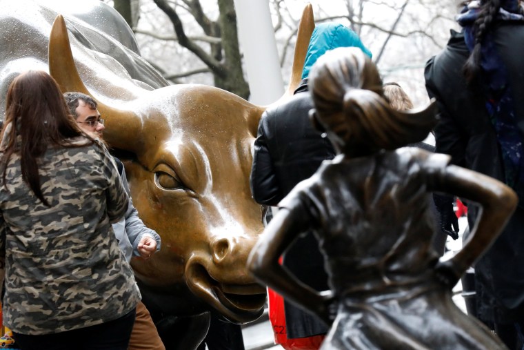 Image: A statue of a girl facing the Wall St. Bull is seen in the financial district in New York