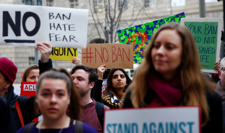 Image: Immigration activists rally outside of the U.S. Customs and Border Protection headquarters in Washington