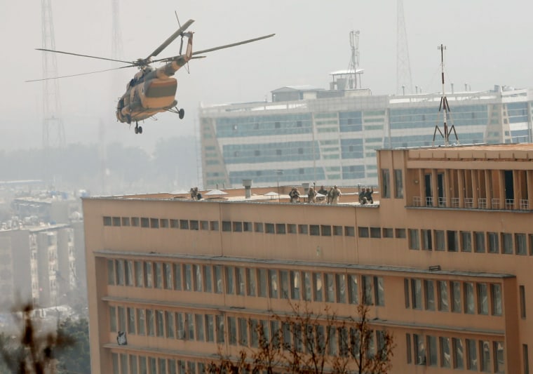 Image: Afghan National Army soldiers descend from helicopter 