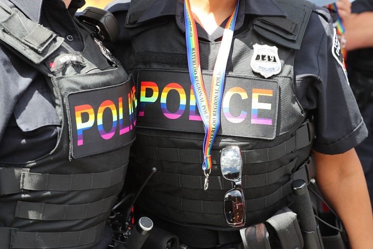 Police sport rainbow police flashes on their vests during the 2016 Toronto Pride parade.