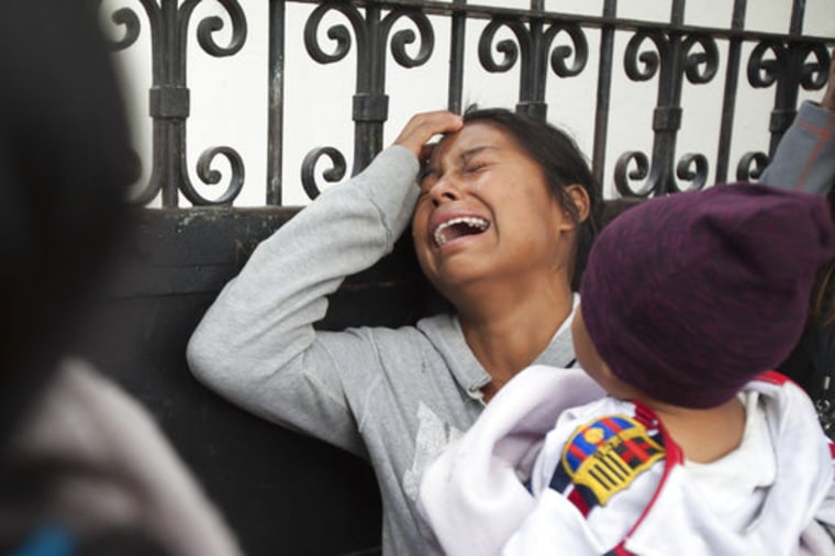 A relative of a youth who resided at the Virgin of the Assumption Safe Home wails as she waits for the release of the names of those who died in a fire at the shelter, outside the morgue where the bodies are being identified in Guatemala City, Thursday, March 9, 2017.