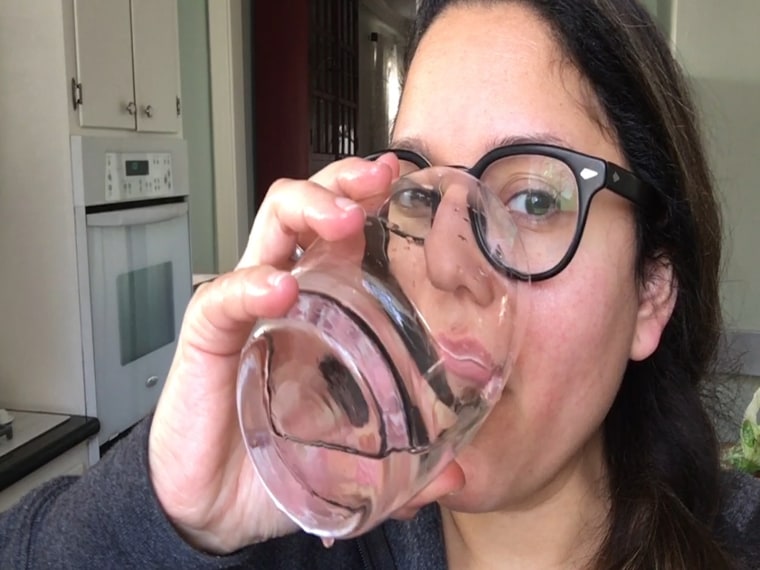 Image: Geraldine Cols Azocar drinks a glass of water