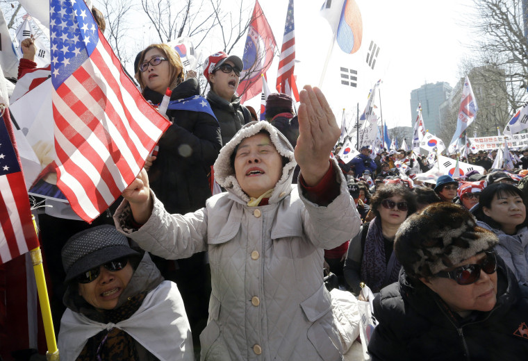 Image: Supporters of the president react during a rally opposing her impeachment near the Constitutional Court in Seoul.