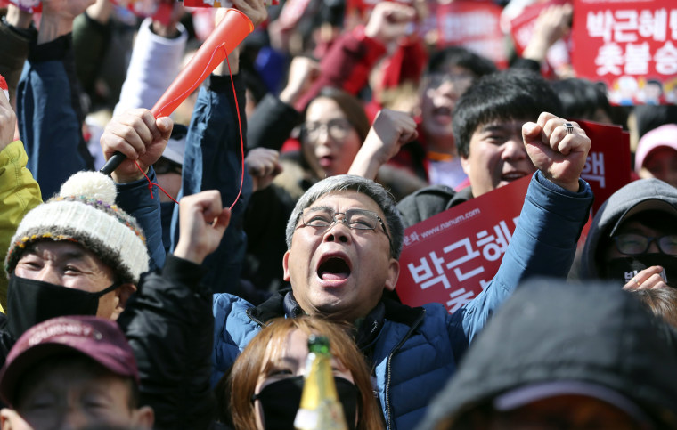 Image: Protesters react after hearing the Constitutional Court's verdict during a rally calling for the impeachment of President Park Geun-hye near the Constitutional Court in Seoul, South Korea, March 10, 2017.