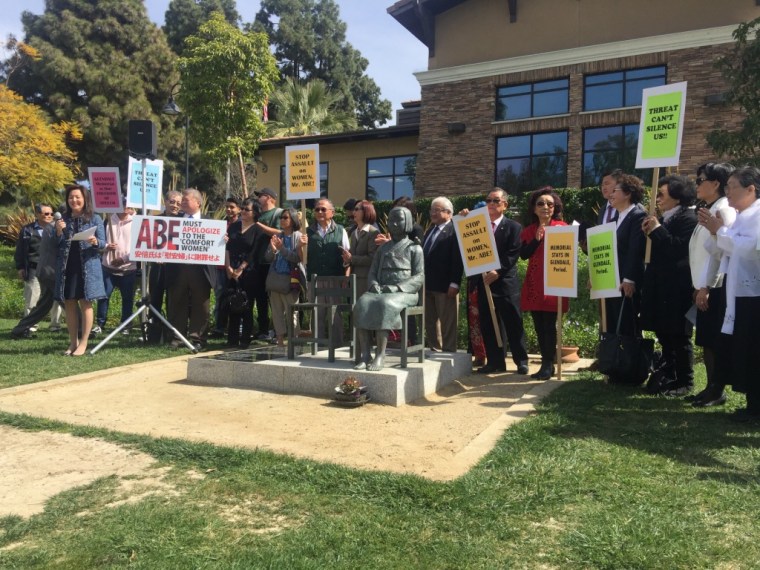 Demonstrators protest at a statue honoring World War II-era "comfort women" after the government of Japan filed an amicus brief with the Supreme Court supporting its removal.