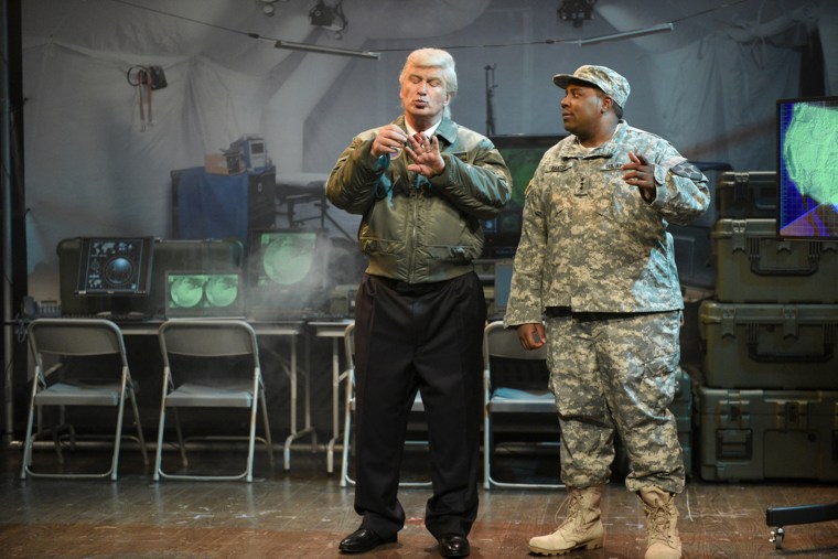 Image: Alec Baldwin dressed as President Donald Trump, alongside Kenan Thompson in sketch for Saturday Night Live, March 11, 2017.