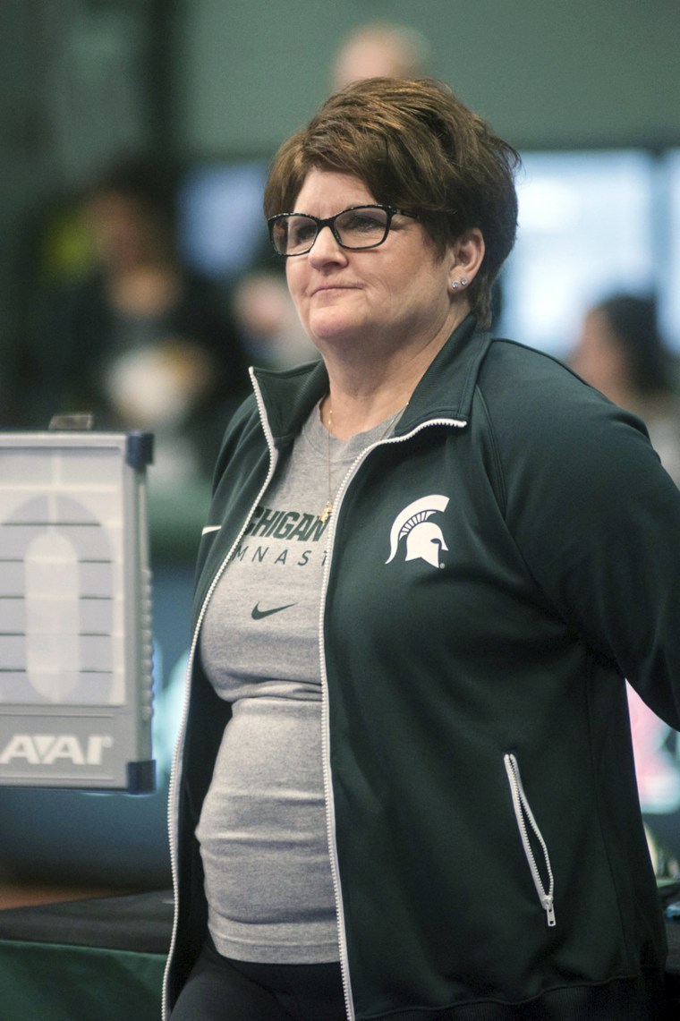 Image: Michigan State University gymnastics head coach Kathie Klages watches the team during a meet in East Lansing, Mich. in February 2015