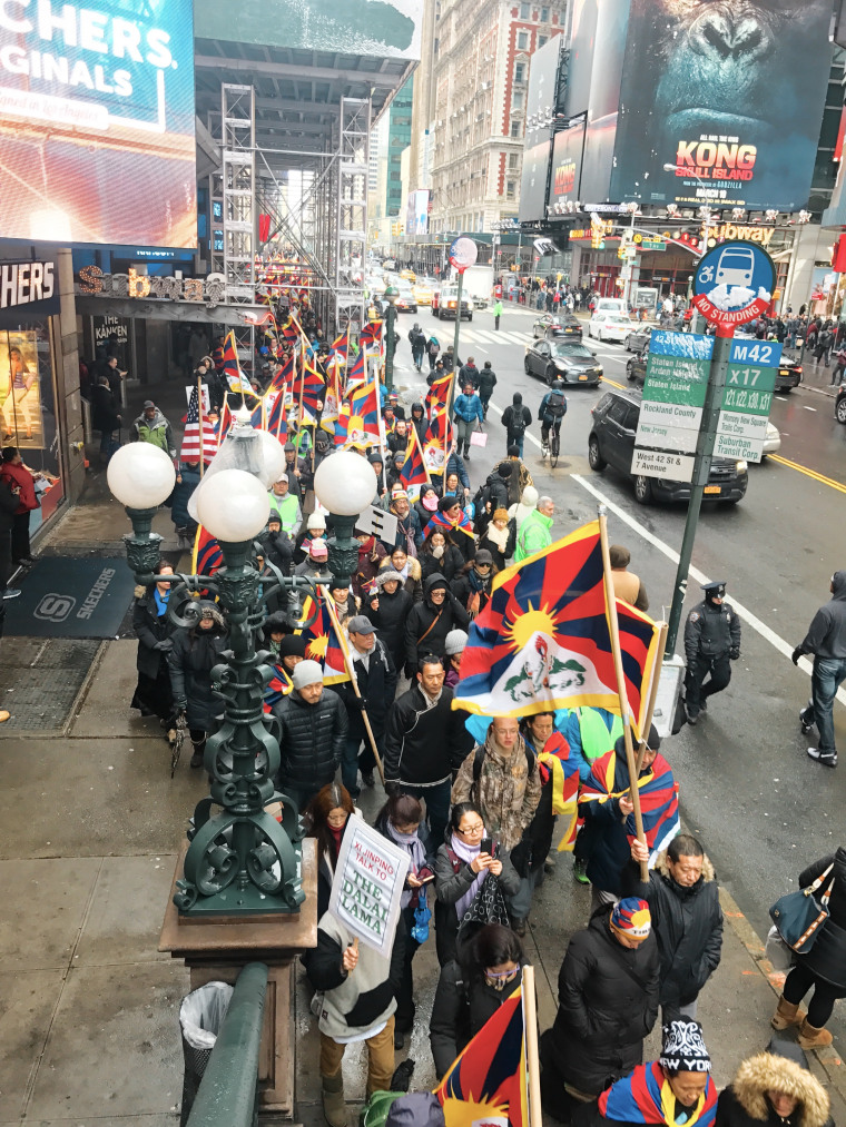 Demonstrators pass through Times Square on Friday, March 10, 2017, shouting slogans such as, "Free Tibet" and "Allow media in Tibet," while passing out pamphlets on the history of Tibetan National Uprising Day.