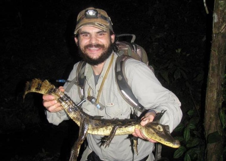 Stephen Baca holding a caiman in Nicaragua.