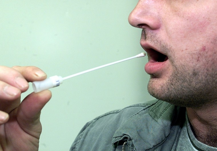 A VOLUNTEER TAKES A SALIVA SAMPLE IN EBERSWALDE.