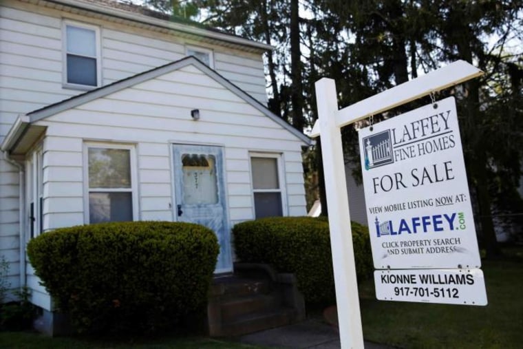A 'for sale' is seen outside a single family house in Garden City, New York