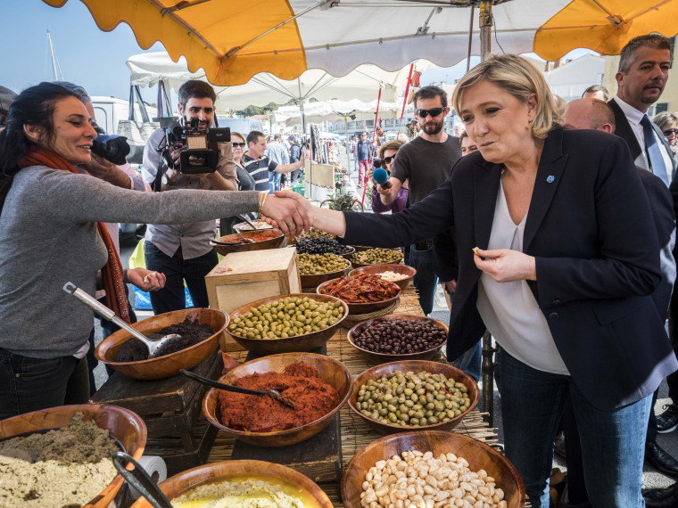 Image: Marine Le Pen visits a market in Le Brusc, France