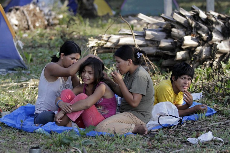 Image: Tsimane indigenous people rest during a march to Yucumo, Bolivia