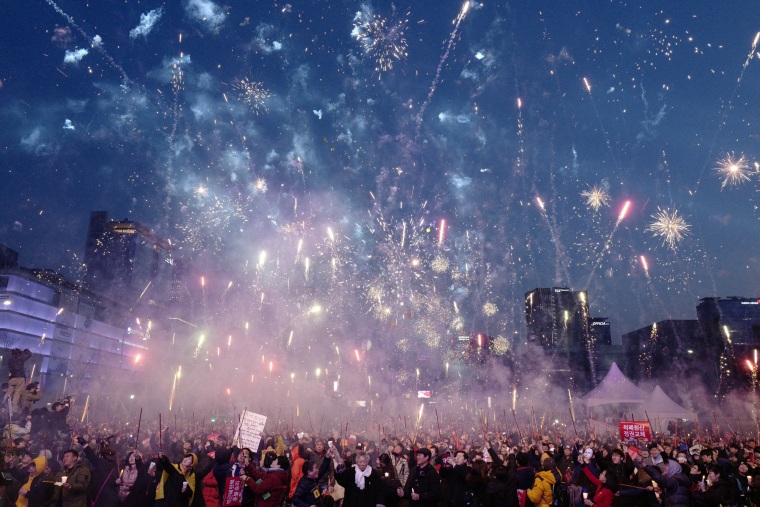 Image: South Koreans gather to celebrate after the court's ruling on the impeachment of South Korean President Park