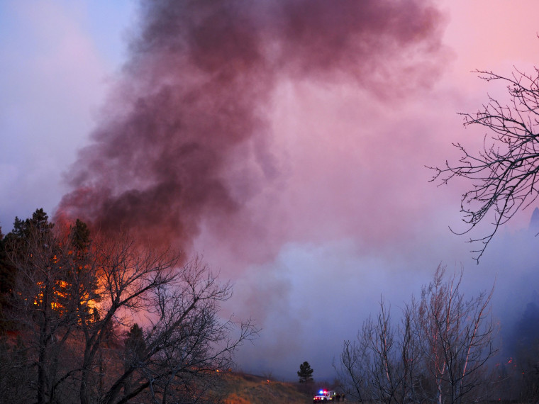 Image: Smoke rises from a wildfire Sunday, March 19, 2017, in Boulder, Colorado.