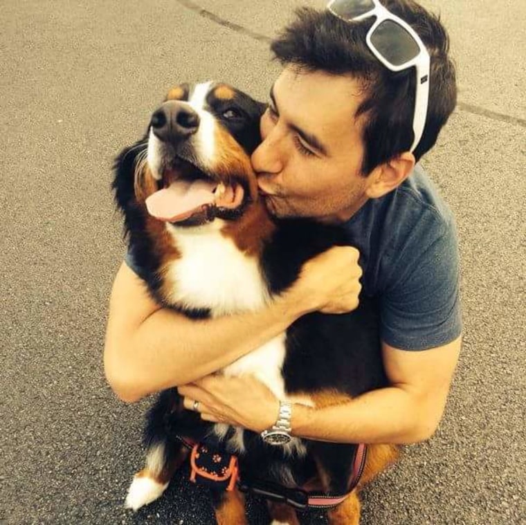 Christopher Vrankovic hugs his dog, Lucy