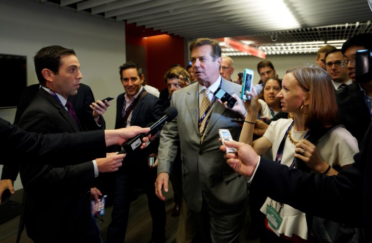 Image: Manafort, campaign manager to Republican Presidential Candidate Trump, is surrounded by reporters asking about the Republican National Convention Committee on Rules in Cleveland