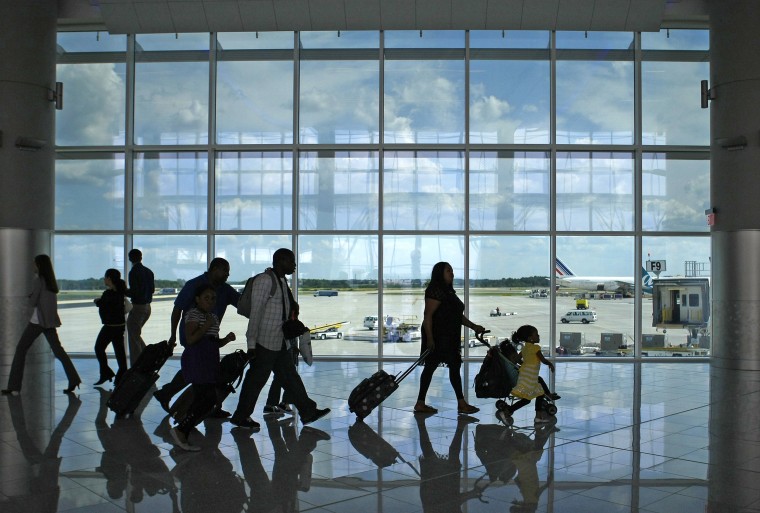 Passengers walk through the newly opened Maynard H. Jackson Jr. International Terminal in Atlanta, Georgia