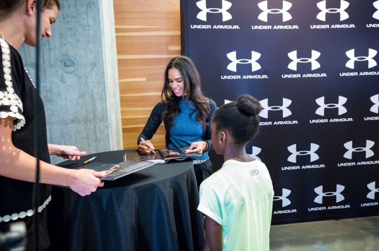Misty Copeland signs her book at an event at the UA House.