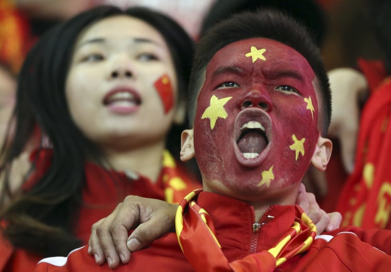 Image: China soccer fans celebrate win over South Korea