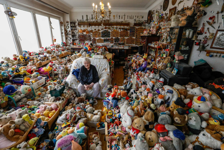 Image: Belgian Catherine Bloemen, 86, sits among more than 20,000 stuffed and plastic toys, she is collecting for more than 65 years, in her house in Brussels