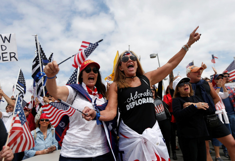 Image: Demonstrators protest at the beach in support of U.S. President Donald Trump during a rally in Huntington Beach