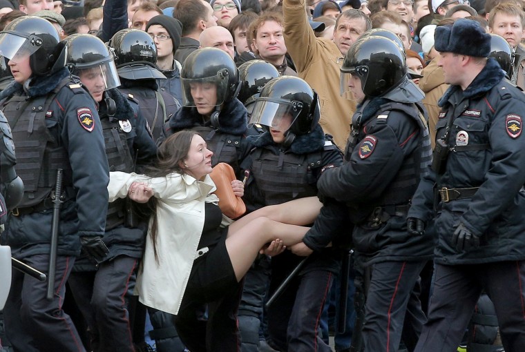 Image: Police detain a demonstrator at a rally Sunday in central Moscow