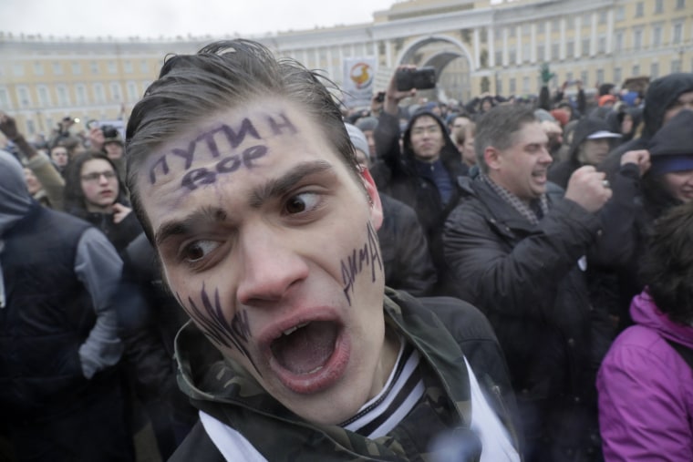 Image: Protesters shout slogans at Dvortsovaya (Palace) Square in St. Petersburg.