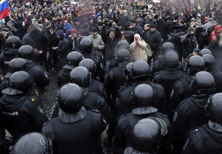 Image: Police stop protesters gathering at Dvortsovaya Square in St. Petersburg.