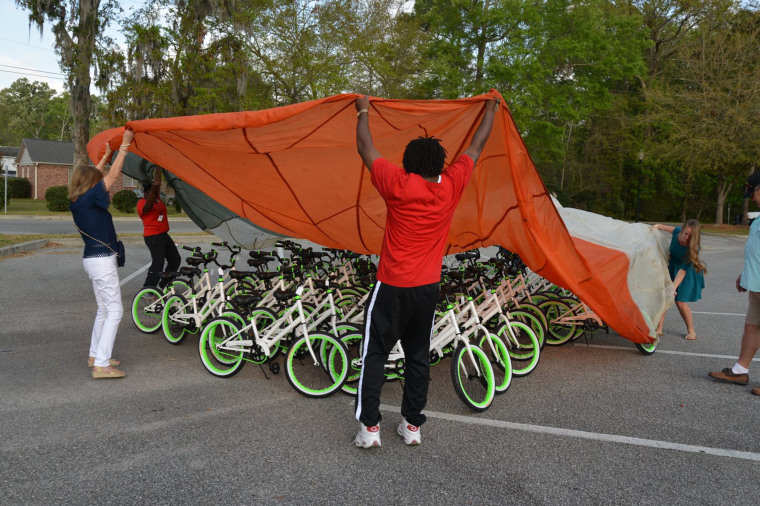 Staff at Pepperhill Elementary School in North Charleston, South Carolina, help with the big reveal. 