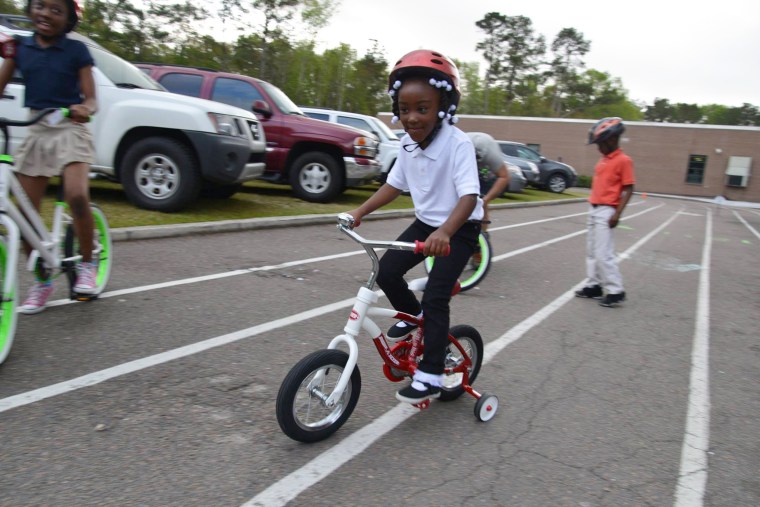 A student tries out his new set of wheels.