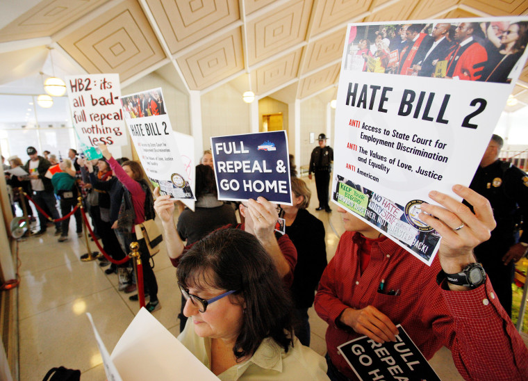 HB2 opponents protest in the gallery above the state's House of Representatives chamber in Raleigh, North Carolina on December 21, 2016.