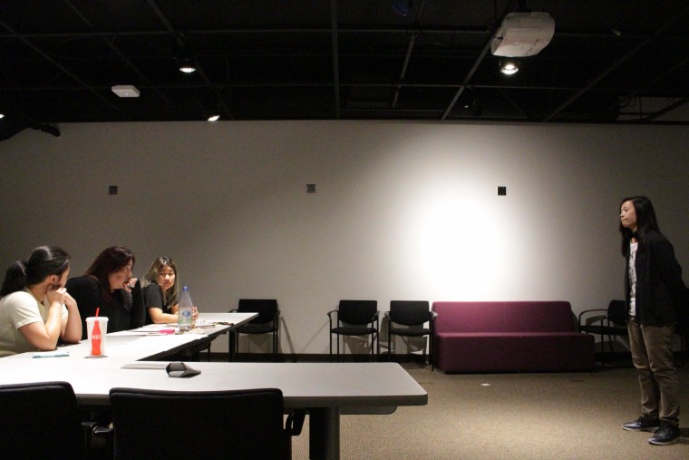 Actor and singer Giselle Austria; director Chari Arespacochaga; and Kristen Asada, president of the Model Minority Theater Troupe; listen to a University of California, Riverside, student audition for a role in "Princess Ten Ten and the Dark Skies."