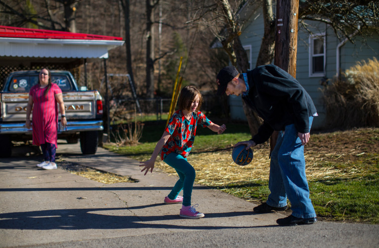 Image: Gabriella Corley plays basketball in the driveway of her home
