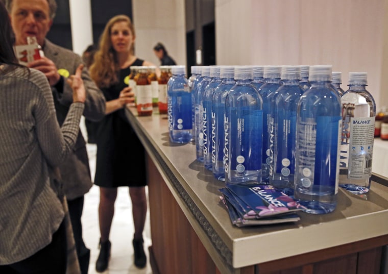 Image: Bottles of water and flavored tea are displayed during The Shine, an alcohol-free social social event at a chic hotel in Williamsburg, Brooklyn on March 8, 2017.