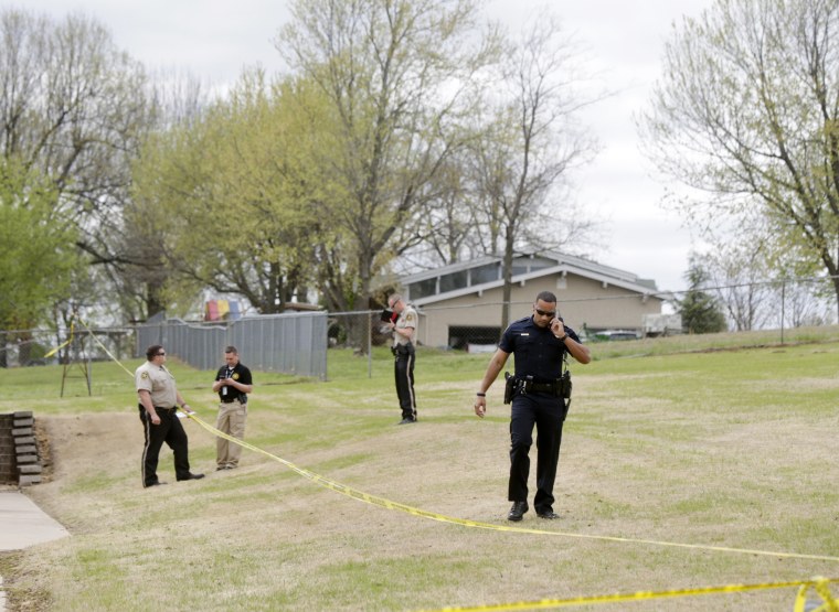 Image: Police investigate the scene of a failed robbery in Broken Arrow, Okla.