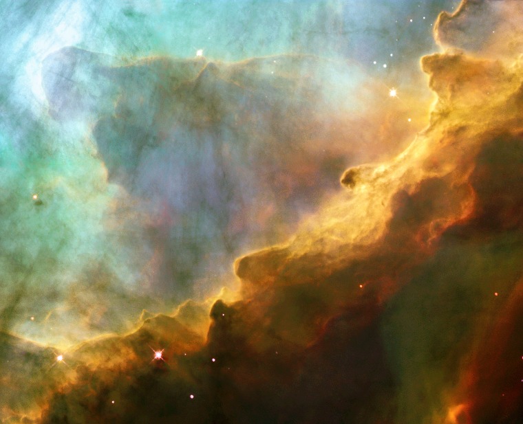 RESEMBLING THE FURY OF A RAGING SEA, THIS IMAGE ACTUALLY SHOWS A BUBBLY OCEAN OF GLOWING GYDROGEN GAS AND SMALL AMOUNTS OF OTHER ELEMENTS SUCH AS OXYGEN AND SULFUR.  PHOTO TAKEN BY NASA'S HUBBLE SPACE TELESCOPE.