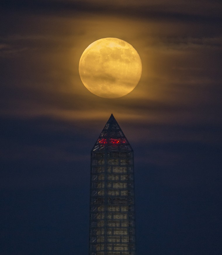 A supermoon rises behind the Washington Monument, Sunday, June 23, 2013, in Washington. This year the Supermoon is up to 13.5% larger and 30% brighter than a typical Full Moon is. This is a result of the Moon reaching its perigee - the closest that it gets to the Earth during the course of its orbit. During perigee on 23 June the Moon was about 221,824 miles away, as compared to the 252,581 miles away that it is at its furthest distance from the Earth (apogee). Photo Credit: (NASA/Bill Ingalls)