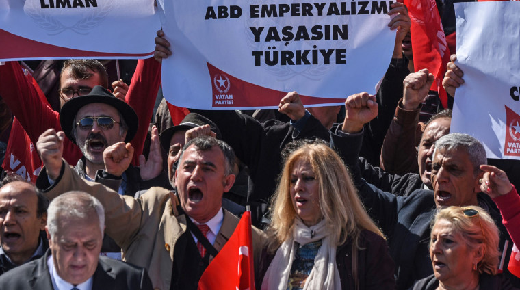 Image: Supporters of the Vatan Partisi, or Patriotic Party, shout slogans and hold signs condemning "American imperialism"