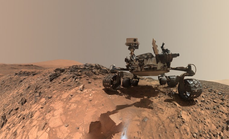 A self-portrait of the Mars Curiosity Rover from the Buckskin drill site, taken with the Mars Hans Lens Imager camera, reveals a rock stuck to the left middle wheel.