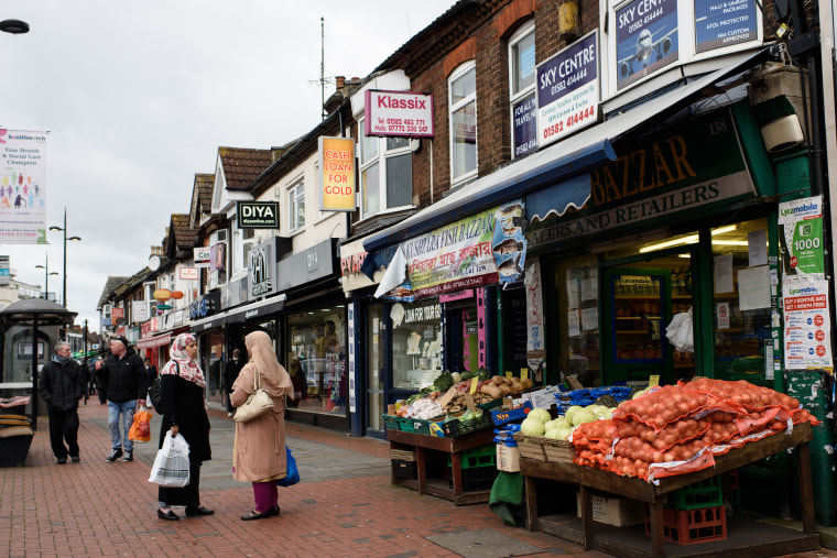 Image: Two women shop at a local grocery in Bury Park, Luton on Feb. 4, 2015.