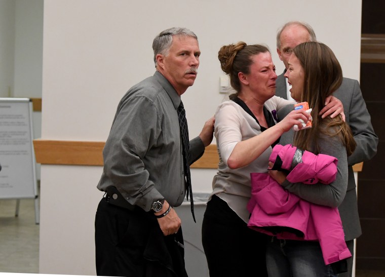 Image: Friends and family of Tina Tournai Sandoval come out of a courtroom after her estranged husband John Sandoval pleaded guilty to killing her on March 31, 2017 in Greeley, Colorado.