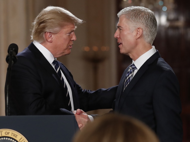 Image: President Donald Trump shakes hands with 10th U.S. Circuit Court of Appeals Judge Neil Gorsuch, his choice for Supreme Court Justices in the East Room of the White House in Washington, D.C. on Jan. 31.