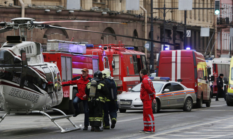 Image: General view of emergency services attending the scene outside Sennaya Ploshchad metro station, following explosions in two train carriages in St. Petersburg